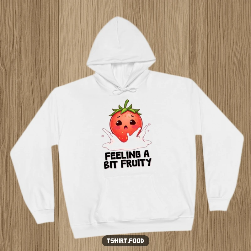 Funny surprised strawberry blushing as it falls into a milk splash hoodie, a blushing strawberry landing in creamy milk, perfect for humorous warmth.