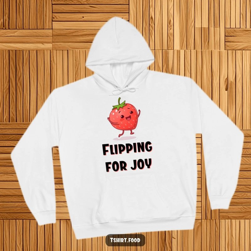 Funny hoodie with a smiling strawberry character doing a happy cartwheel, combining cozy comfort with energetic and fruity humor.