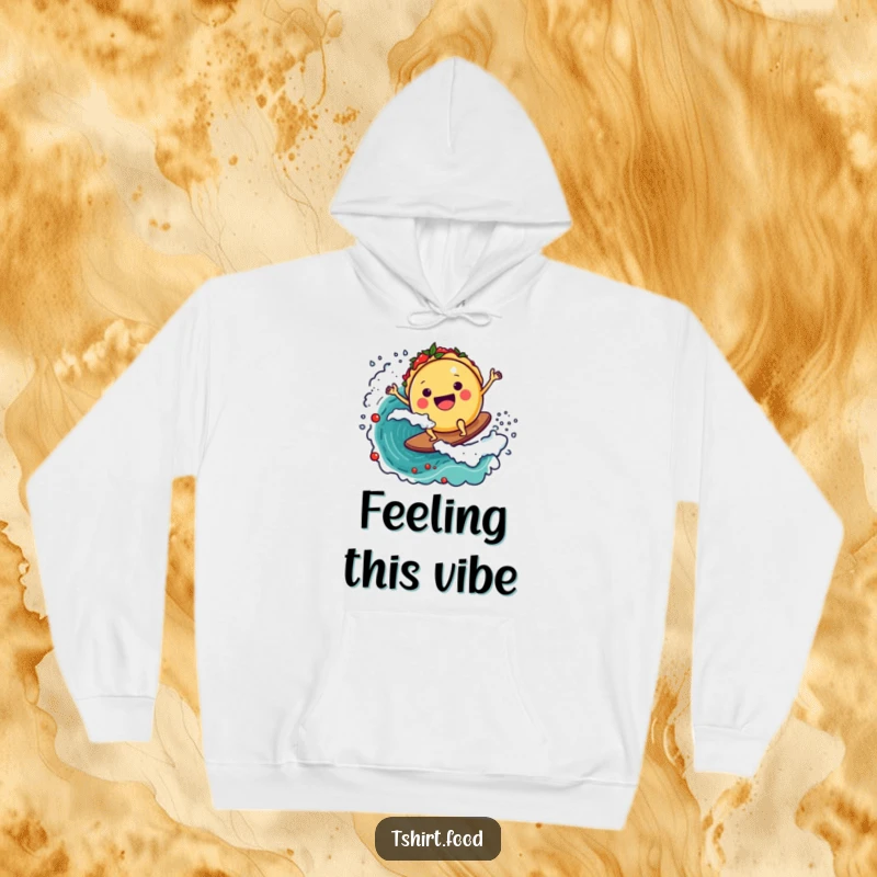 Funny hoodie graphic of a cheerful round taco character expertly surfing a massive, energetic wave of bright red salsa, looking ecstatic.